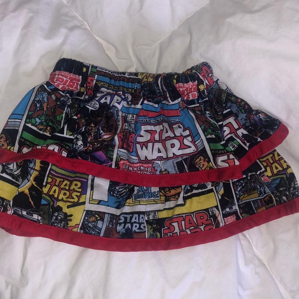 Baby skirt, handmade with Star Wars print fabric and red trim